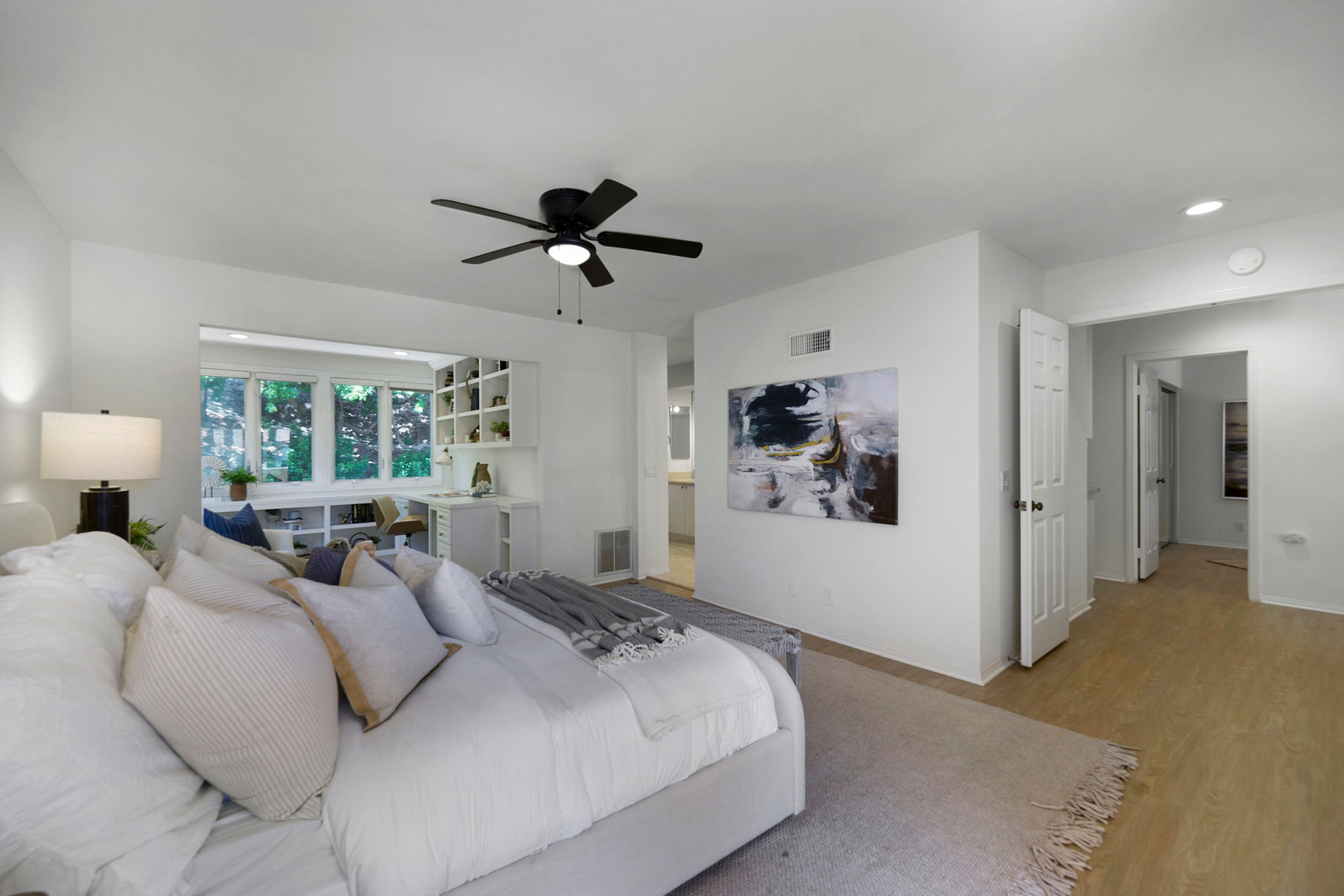 Del Mar staged primary bedroom neutral coastal tones